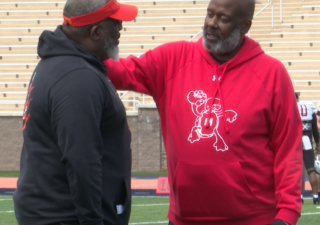 Mike Locksley and Damon Wilson celebrate Baltimore Day